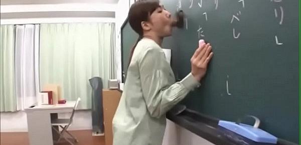  Japanese teacher gives a valuable lesson at the blackboard